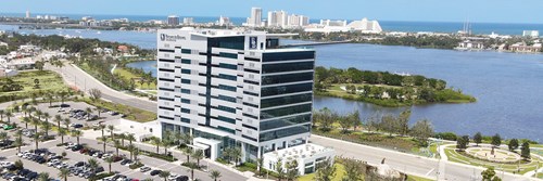 tall white office building in waterfront location - daytona beach florida