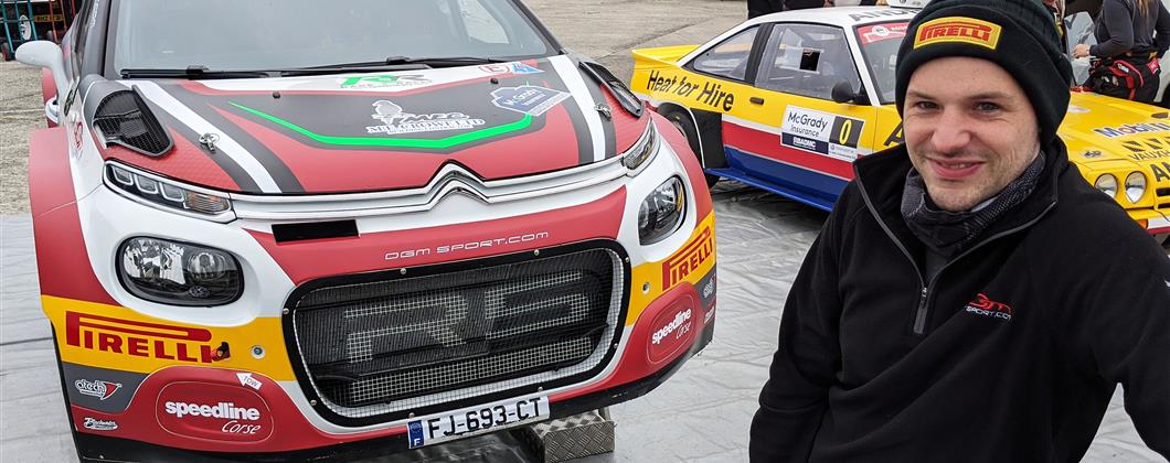 Reigning NI Champion Jonny Greer in front of his car